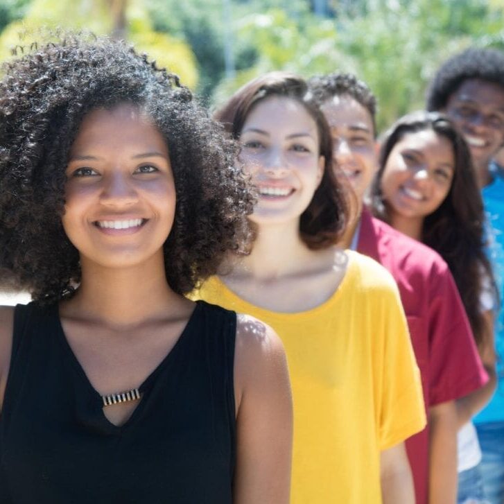 A group of people standing next to each other.