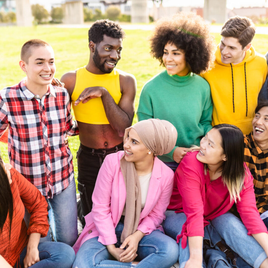 Happy young multiracial group A group of people sitting on the ground